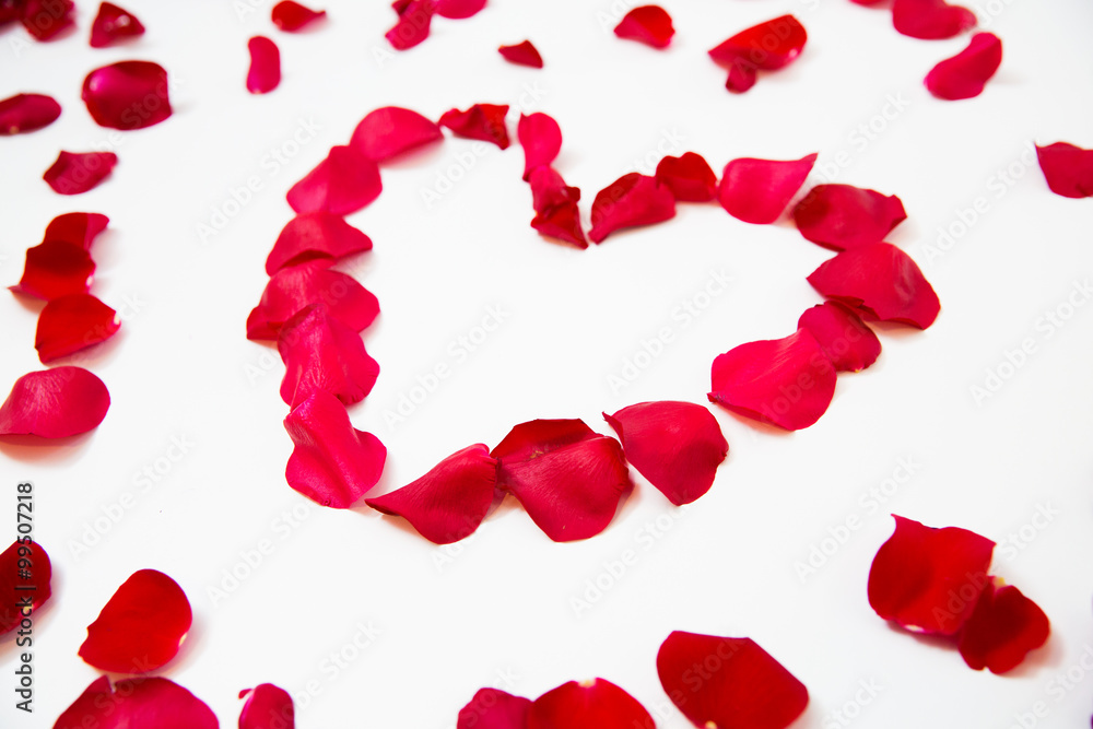 close up of red rose petals in heart shape close up of red rose petals in heart shape