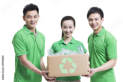 Happy volunteers recycling