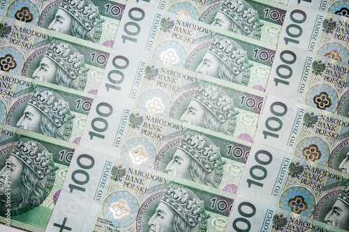 Polish currency banknotes as a background 100 zl