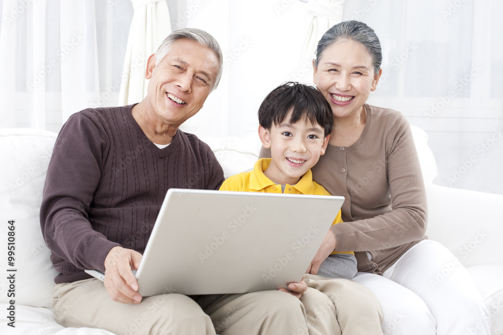 Grandparents and grandson using laptop Grandparents and grandson using laptop