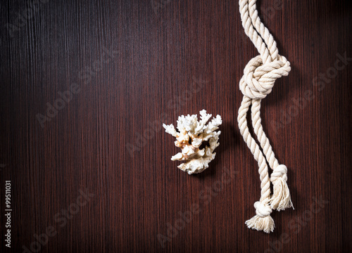 Rope with white coral on wood table