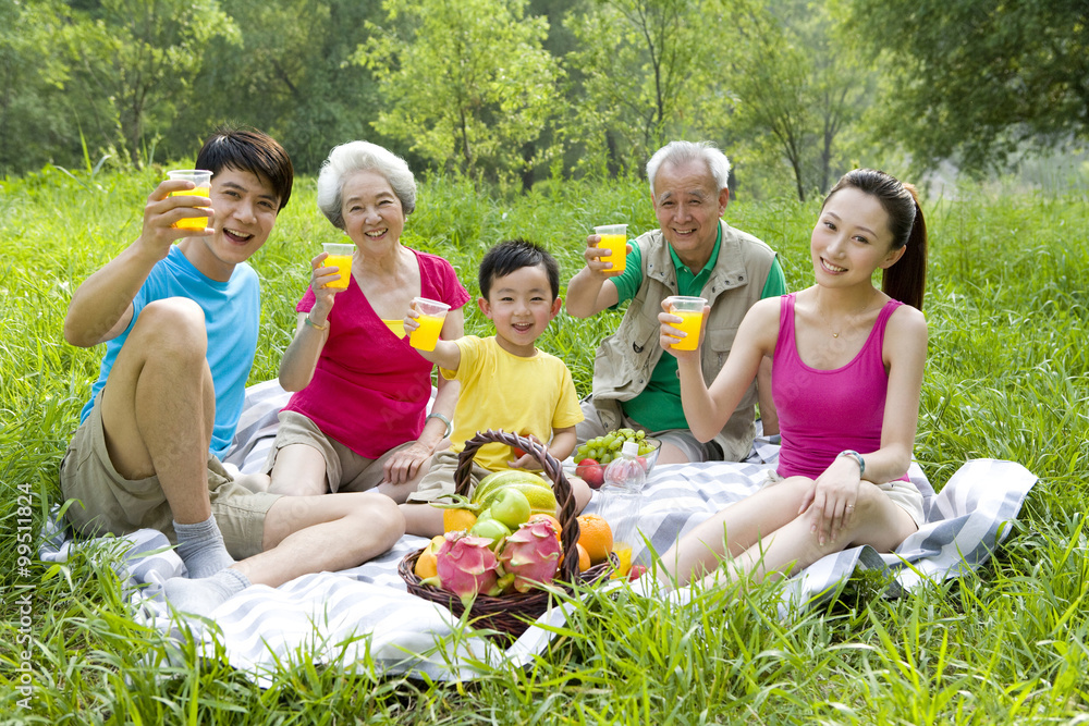 Portrait of a family picnicking Portrait of a family picnicking