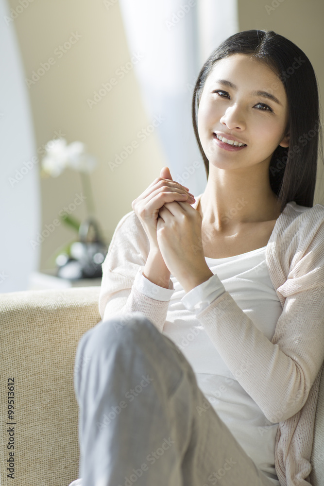 Young woman rubbing moisturizer on hands Young woman rubbing moisturizer on hands