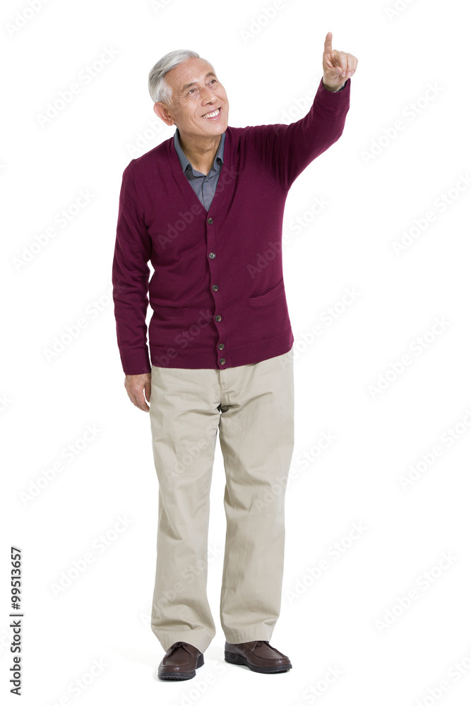 Cheerful senior man pointing away Cheerful senior man pointing away