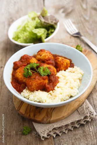 Chicken meatballs with tikka sauce and couscous