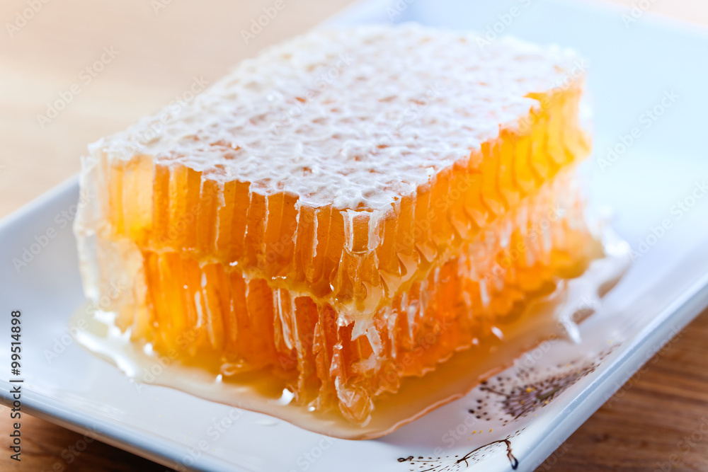 honeycomb on wooden table honeycomb on wooden table