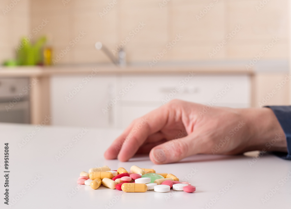 Man taking pills Man taking pills