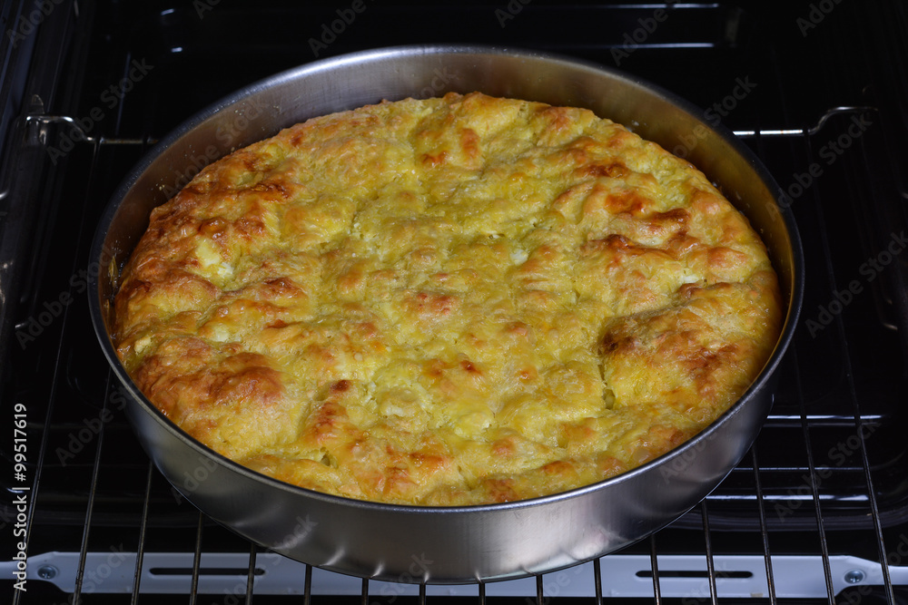 Traditional bulgarian food banitsa stuffed with cheese in electric oven Traditional bulgarian food banitsa stuffed with cheese in electric oven