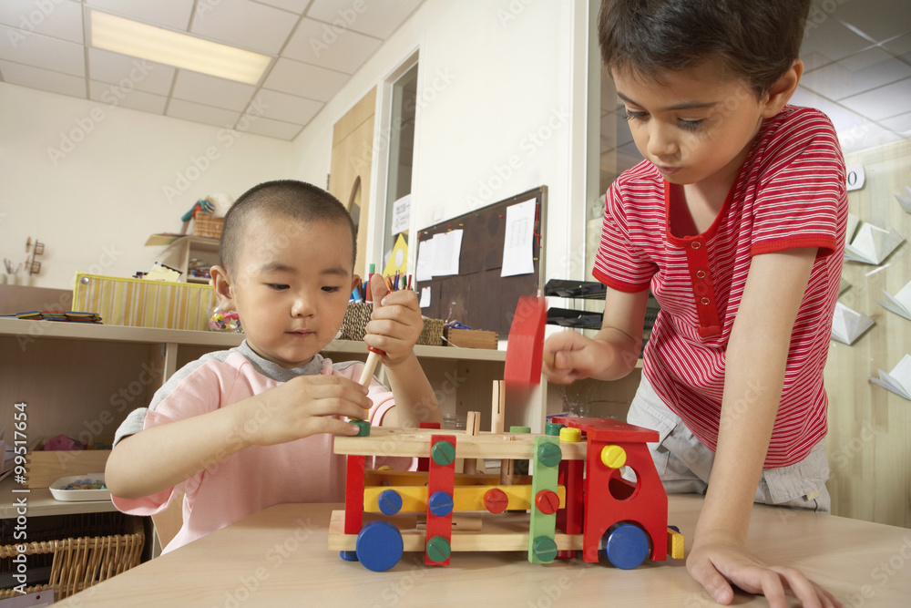 Young Children Building A Toy Truck Young Children Building A Toy Truck