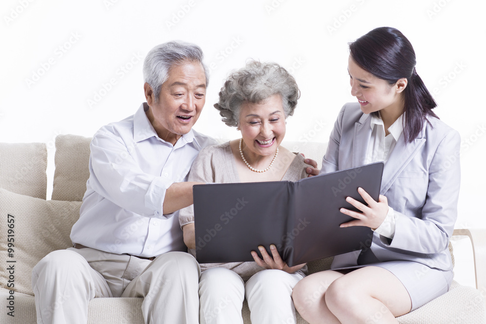 Senior couple chatting with financial advisor Senior couple chatting with financial advisor