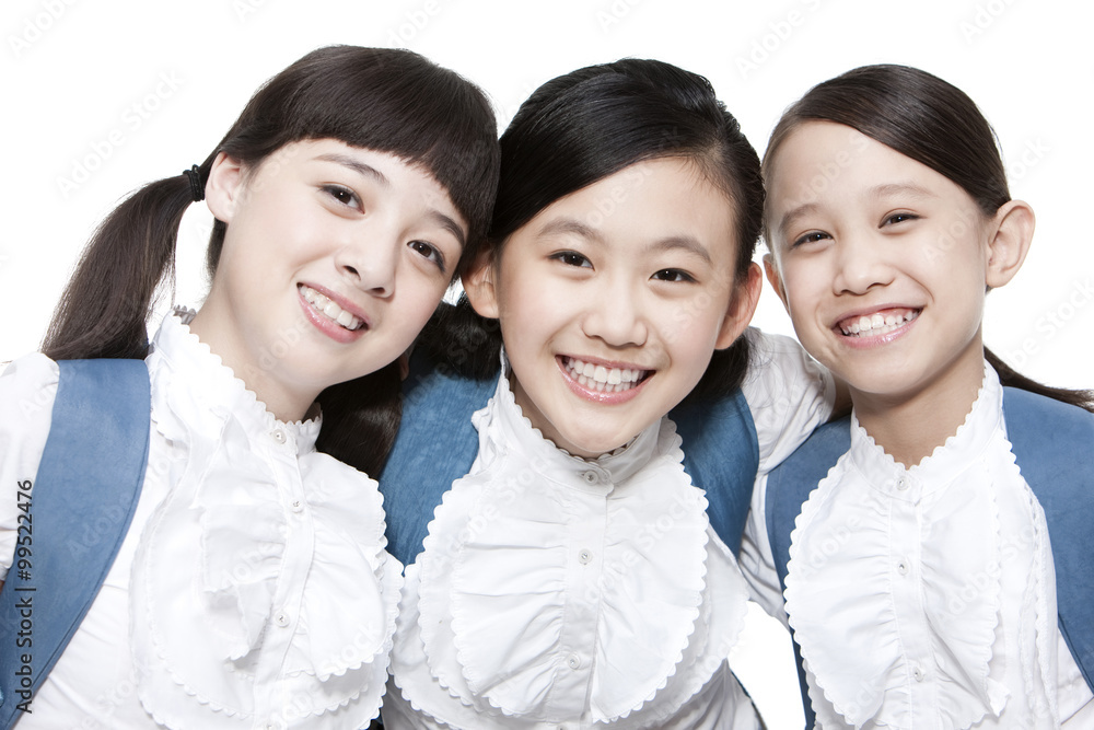 Portrait of intimate schoolgirls smiling with schoolbag on the back Portrait of intimate schoolgirls smiling with schoolbag on the back