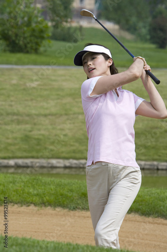 Portrait of a female golfer on the course