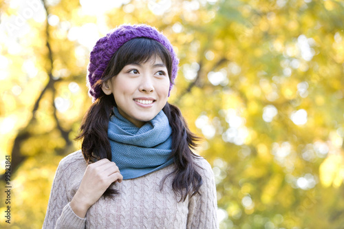 Young Woman in a Park in Autumn