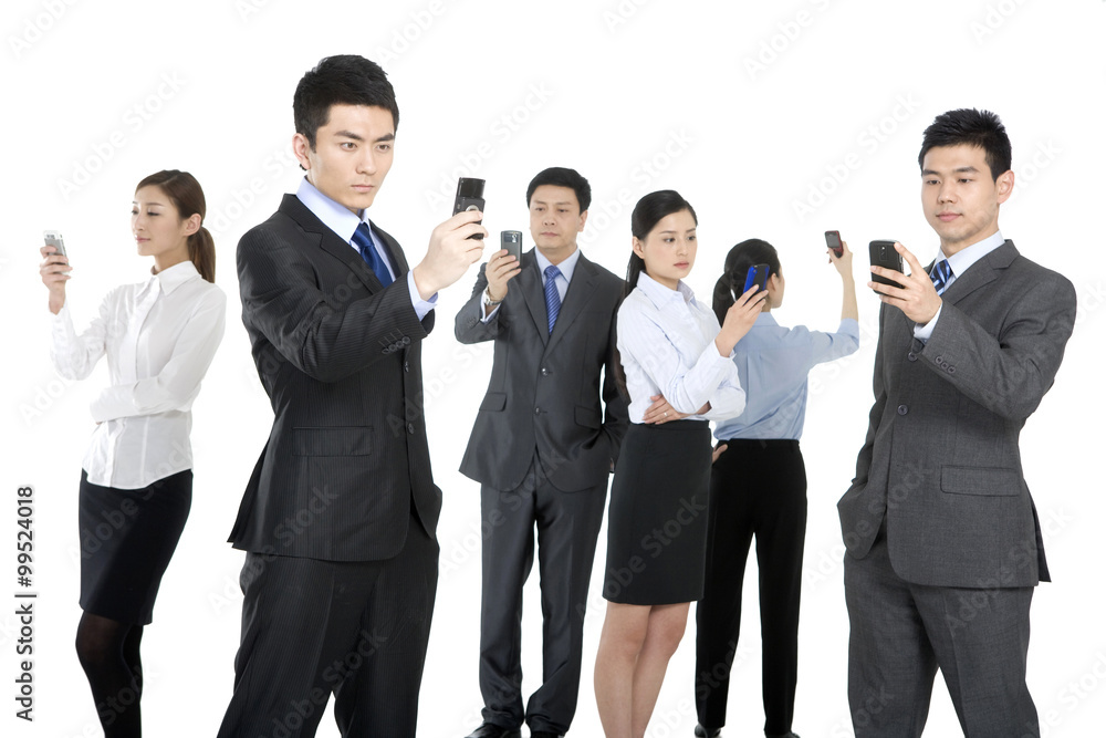 Business people on their mobile phones Business people on their mobile phones