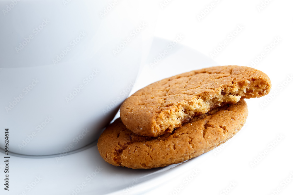 Ginger biscuits with cup and saucer. Ginger biscuits with cup and saucer.