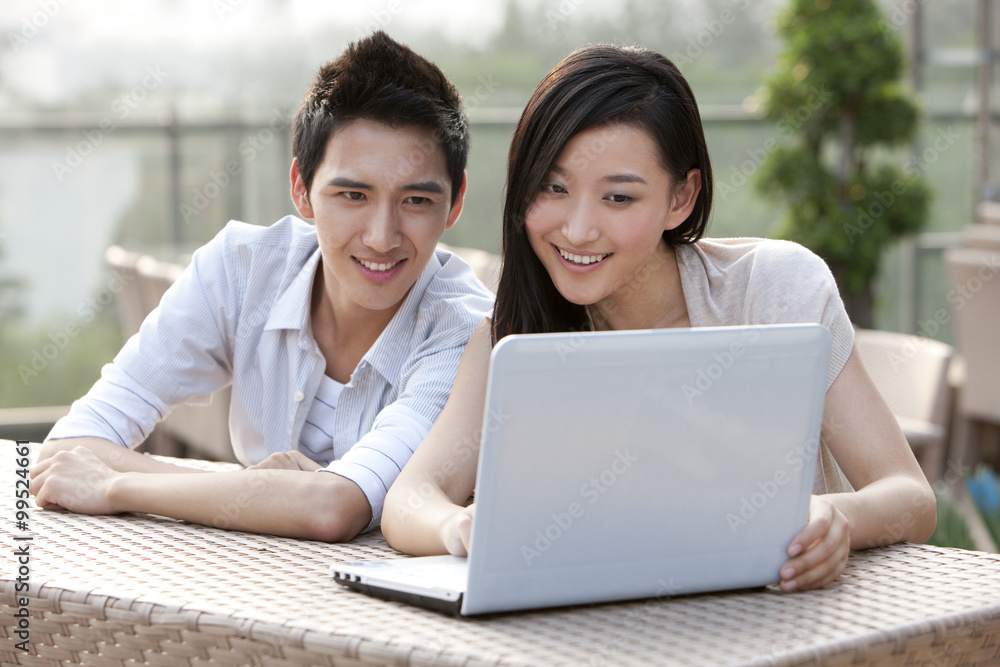 Couple Using Laptop, Outdoors Couple Using Laptop, Outdoors