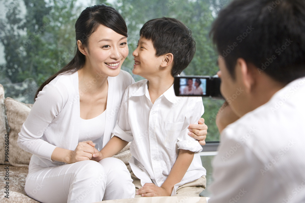 Father taking pictures for family