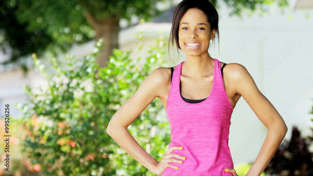 Portrait of young African American girl warming up outdoors Portrait of young African American girl warming up outdoors