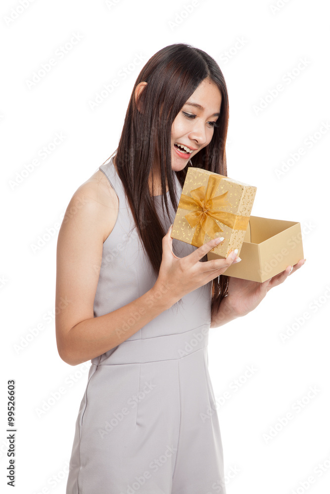 Beautiful young Asian woman with golden gift box Beautiful young Asian woman with golden gift box