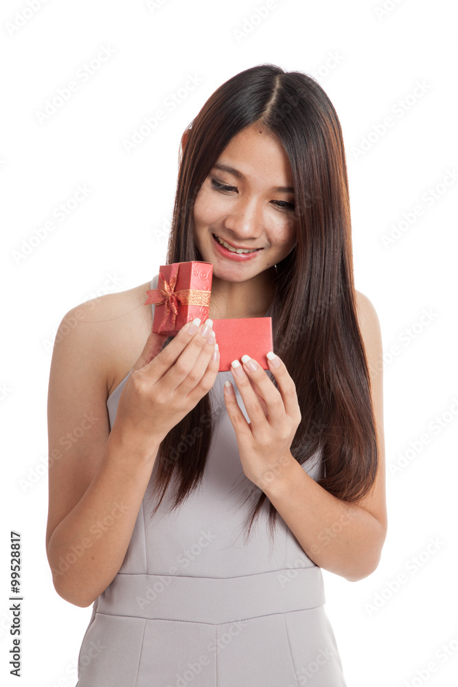 Beautiful young Asian woman open red gift box Beautiful young Asian woman open red gift box