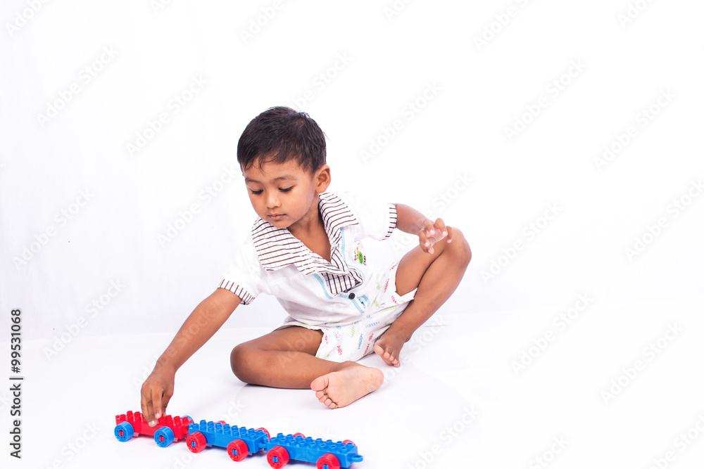 little asian boy play car plastic toy little asian boy play car plastic toy