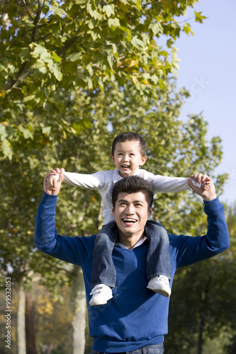 Portrait of father and son in the park