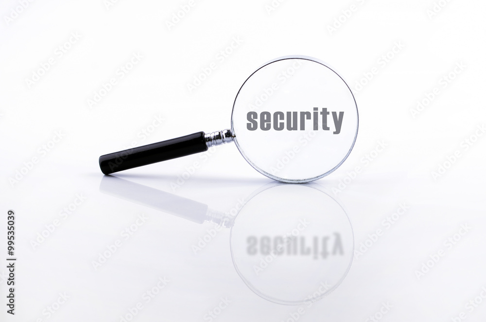 Magnifying glass in a metal frame with rubber black handle Magnifying glass in a metal frame with rubber black handle