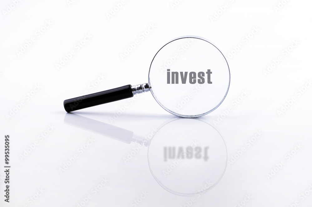 Magnifying glass in a metal frame with rubber black handle Magnifying glass in a metal frame with rubber black handle