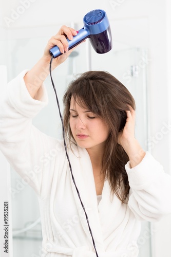 Woman drying hair hair