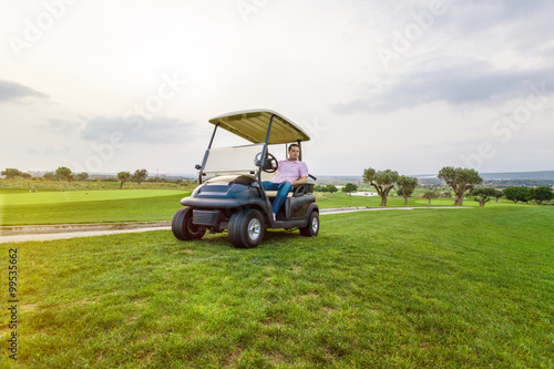 golf man in cart enjoy