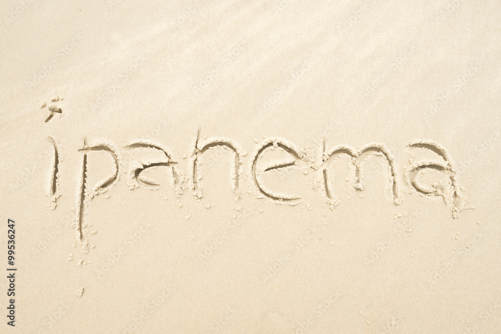 Ipanema, the famous beach, message handwritten on smooth sand in Rio de Janeiro, Brazil