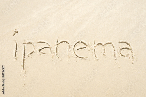 Ipanema, the famous beach, message handwritten on smooth sand in Rio de Janeiro, Brazil