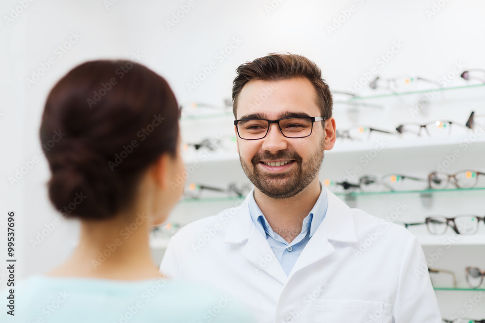 woman and optician in glasses at optics store woman and optician in glasses at optics store