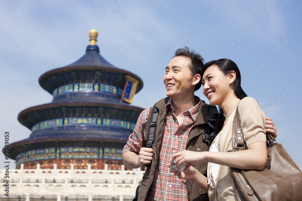 Fototapeta premium Young couple travelling at Temple of Heaven in Beijing, China