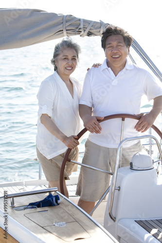 Happy senior couple sailing © Blue Jean Images