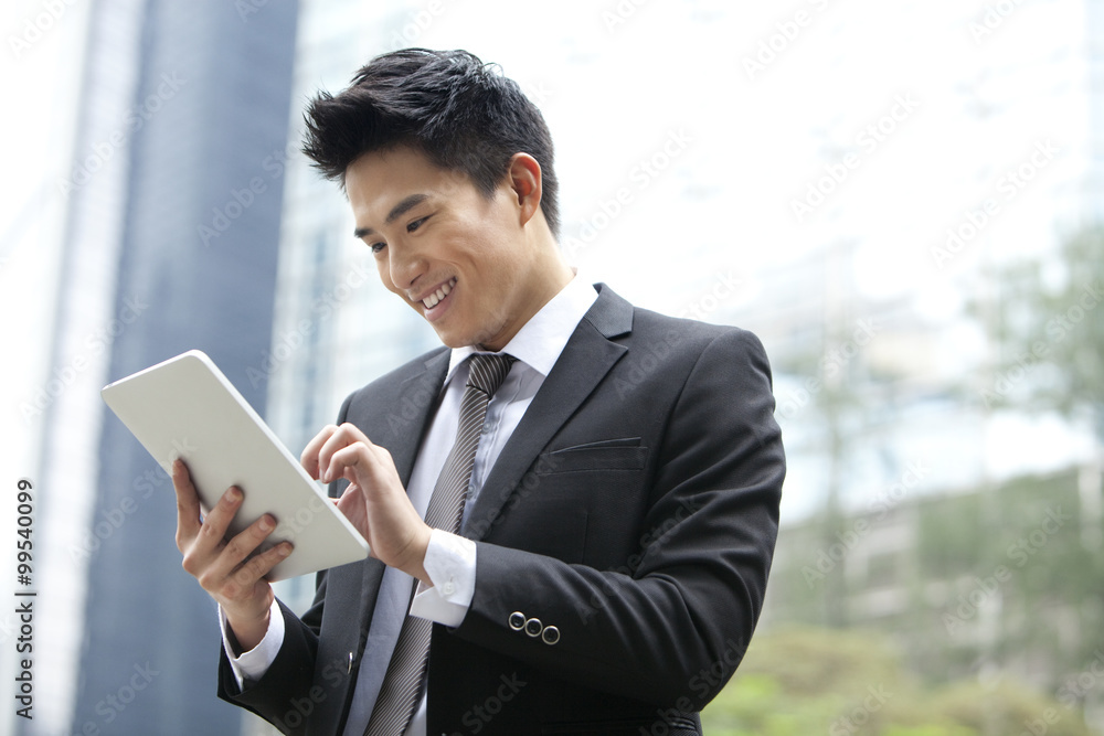 Professional businessman with digital tablet, Hong Kong