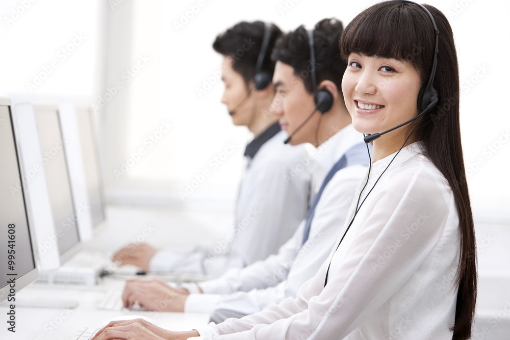 Happy customer service staff at work Happy customer service staff at work