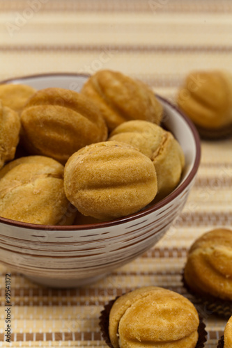 Walnut shaped cookies with caramel and walnuts - Russian Oreshki. Selective focus.
