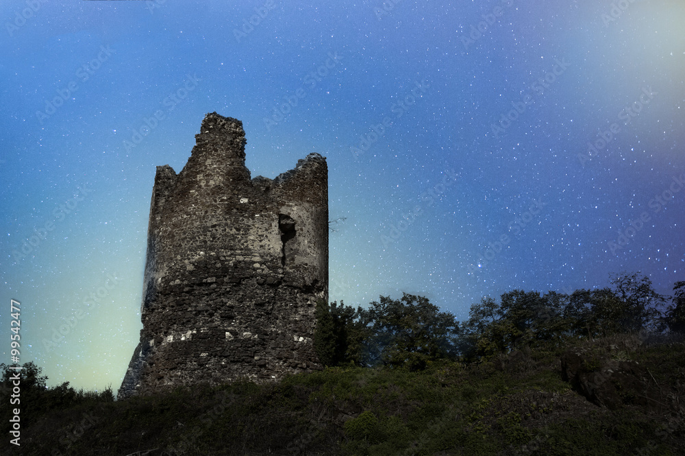 Old castle tower on a night sky background Old castle tower on a night sky background