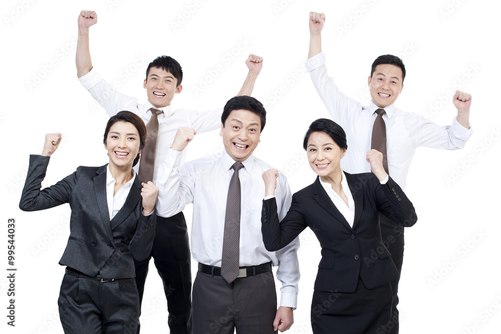 Excited business team punching the air for celebration Excited business team punching the air for celebration