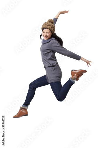 Young woman jumping in mid-air