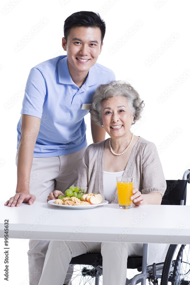 Disabled senior woman having breakfast in nursing home Disabled senior woman having breakfast in nursing home