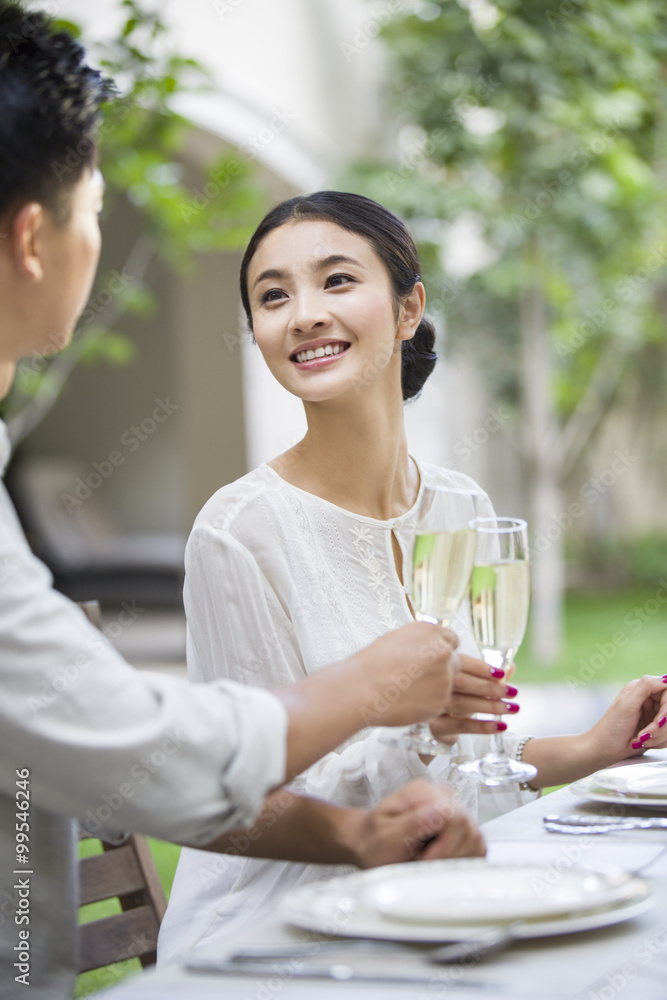 Young couple celebrating with champagne Young couple celebrating with champagne