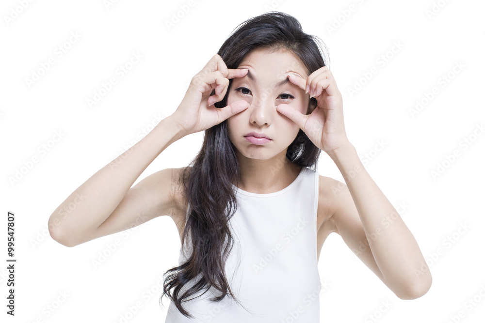 Tired woman propping her eyes with hands Tired woman propping her eyes with hands