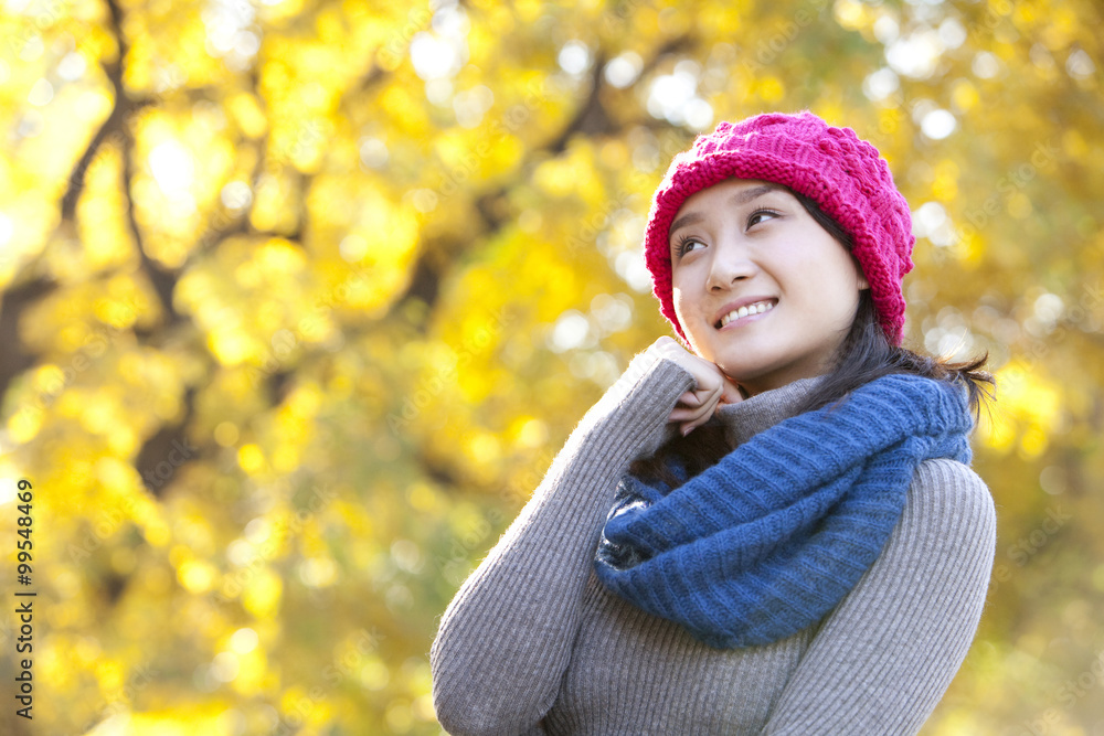 Young Woman in a Park in Autumn Young Woman in a Park in Autumn