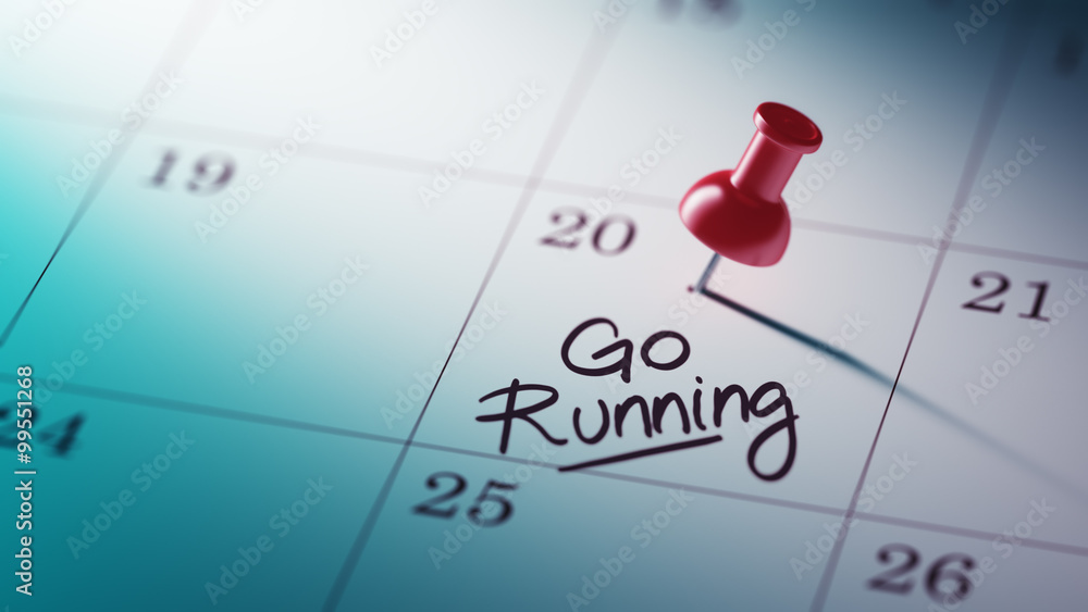 Concept image of a Calendar with a red push pin. Closeup shot of Concept image of a Calendar with a red push pin. Closeup shot of