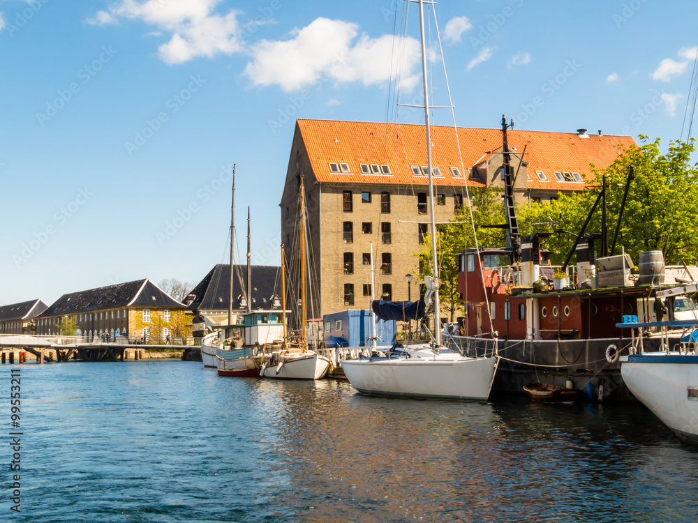 View of the embankment and boats on the channel of Copenhagen, Denmark