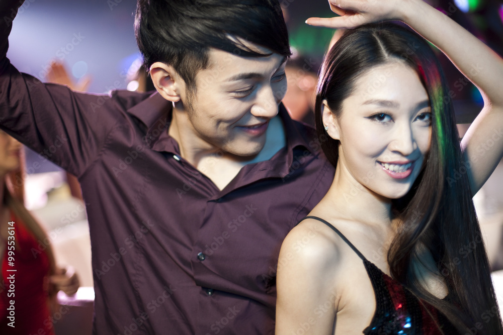 Stylish young people dancing in nightclub Stylish young people dancing in nightclub