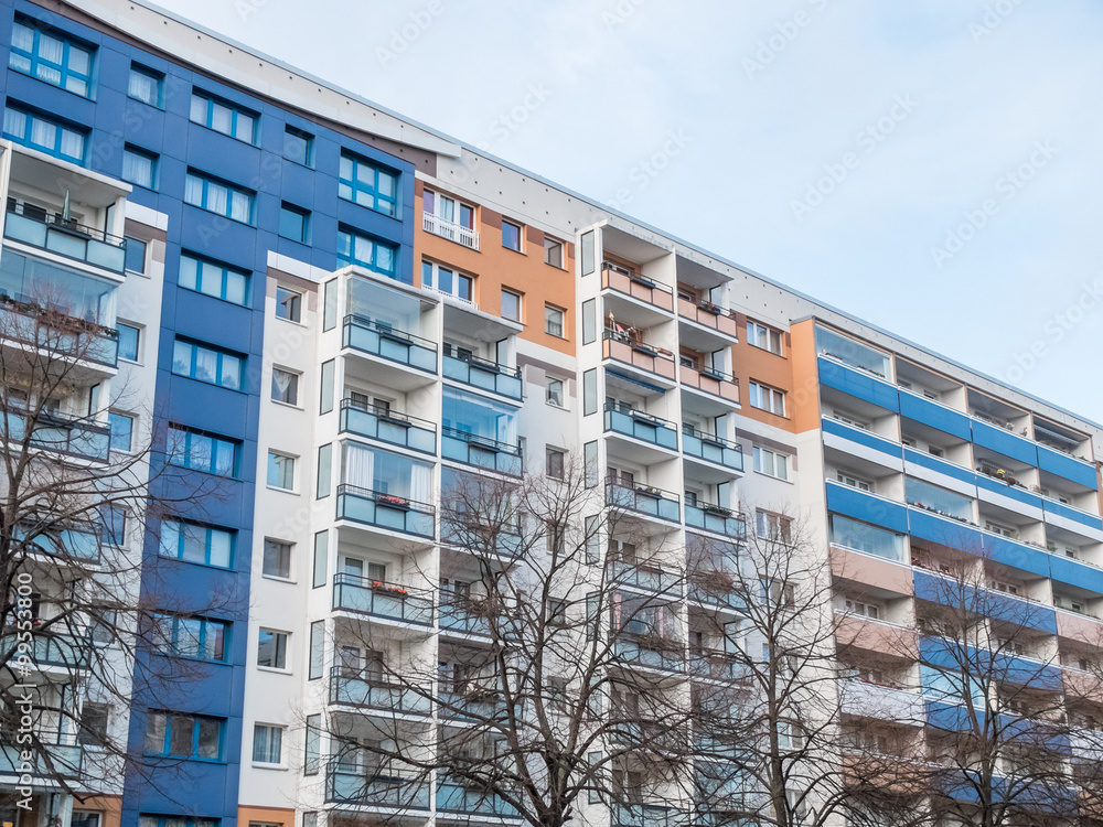 Fototapeta premium Colorful Apartment Building with Bare Trees