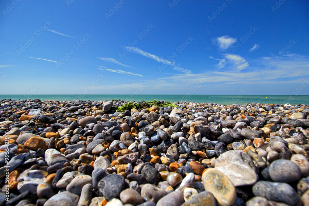 Pebbles on a French beach with blue sky Pebbles on a French beach with blue sky